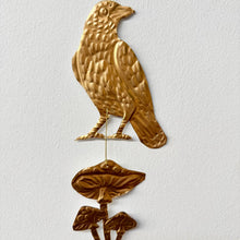 Embossed Gold Tin Crow and Mushrooms Hanging Talisman