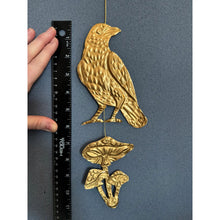 Embossed Gold Tin Crow and Mushrooms Hanging Talisman