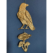 Embossed Gold Tin Crow and Mushrooms Hanging Talisman