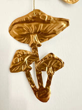 Embossed Gold Tin Crow and Mushrooms Hanging Talisman